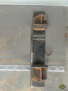 Custom-made scraper to remove skids