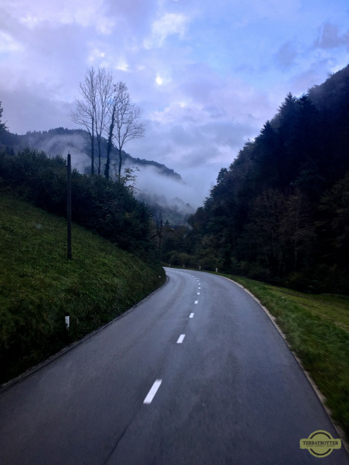 Road with view on the foggy Slovenian Alps