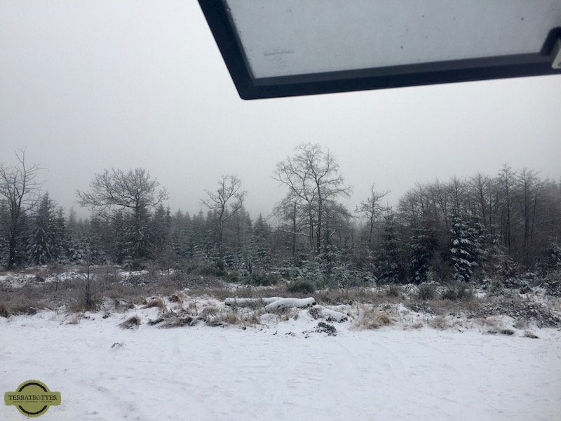 View on winter landscape from window expedition overland camper truck